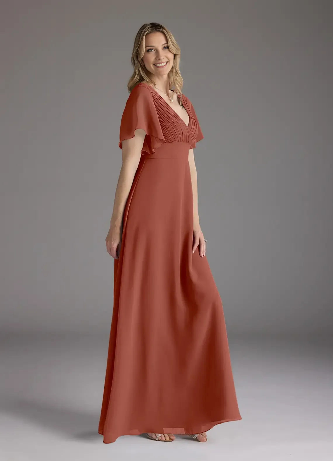 Auburn A-Line V-Neck Pleated Mother of the Bride Dress with Flutter Sleeves and Flowy Maxi Skirt