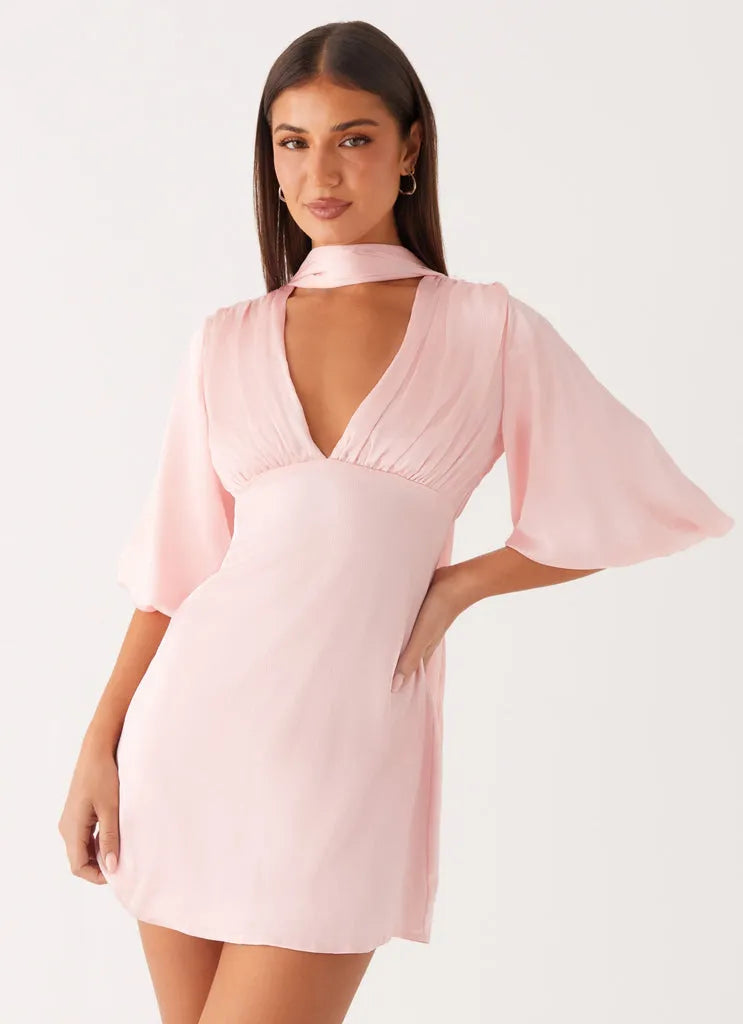 Blush Pink Homecoming Dress with Halter Neckline Deep V Cut Bell Sleeves and Tie - Back Detail