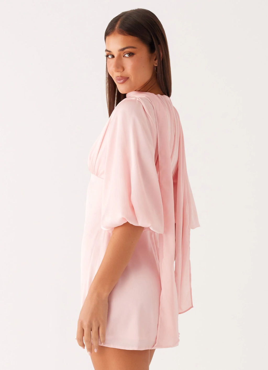 Blush Pink Homecoming Dress with Halter Neckline Deep V Cut Bell Sleeves and Tie - Back Detail