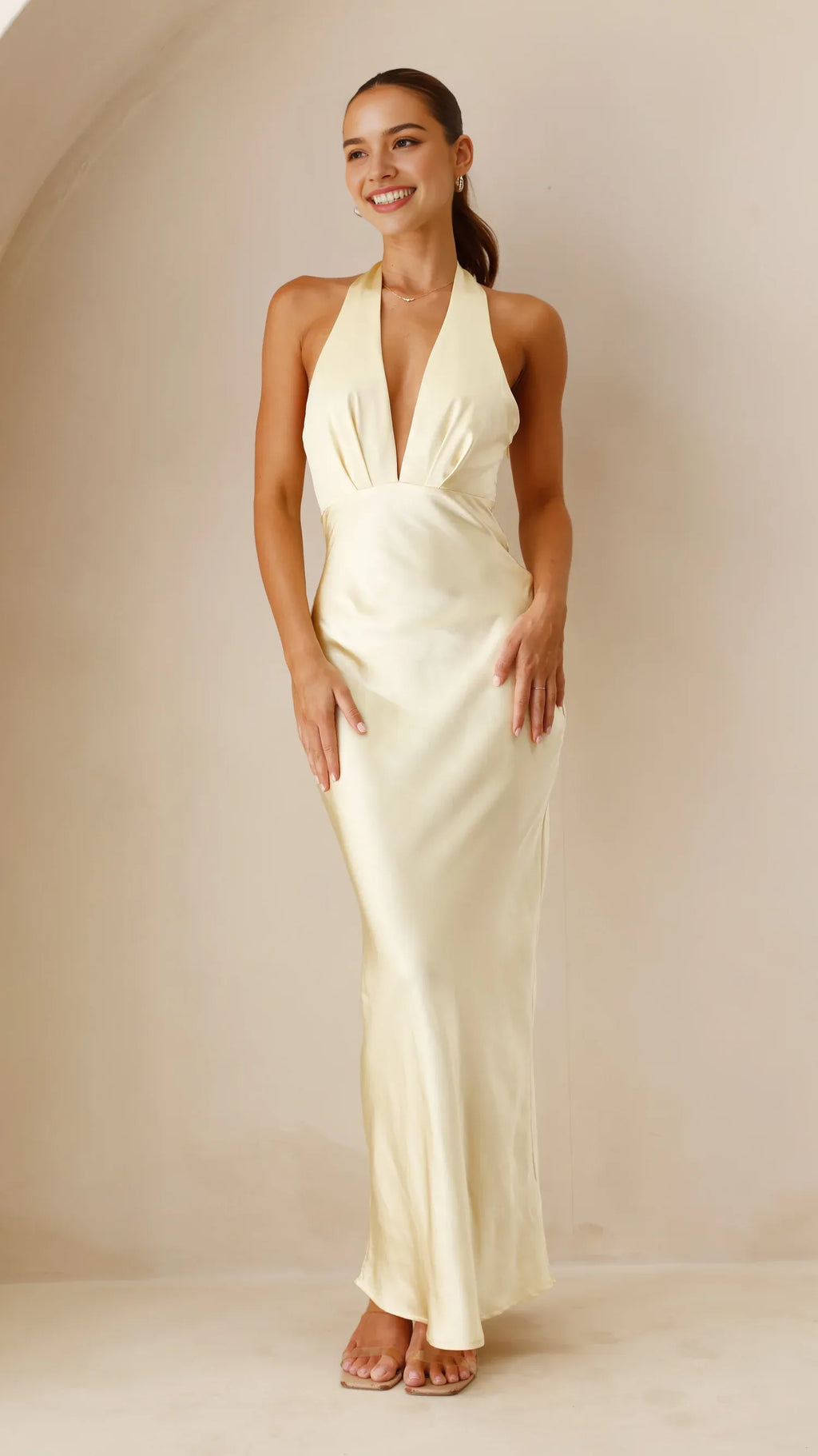 Cream Halter Neck Prom Dress with Deep V - neck Ideal for Sophisticated Prom Nights and Formal Galas
