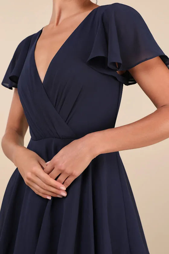 Navy Blue Prom Dress with Flutter Sleeves Surplice V Neckline Tiered Ruffle Skirt and Flowy Floor Length Design for Formal Occasions