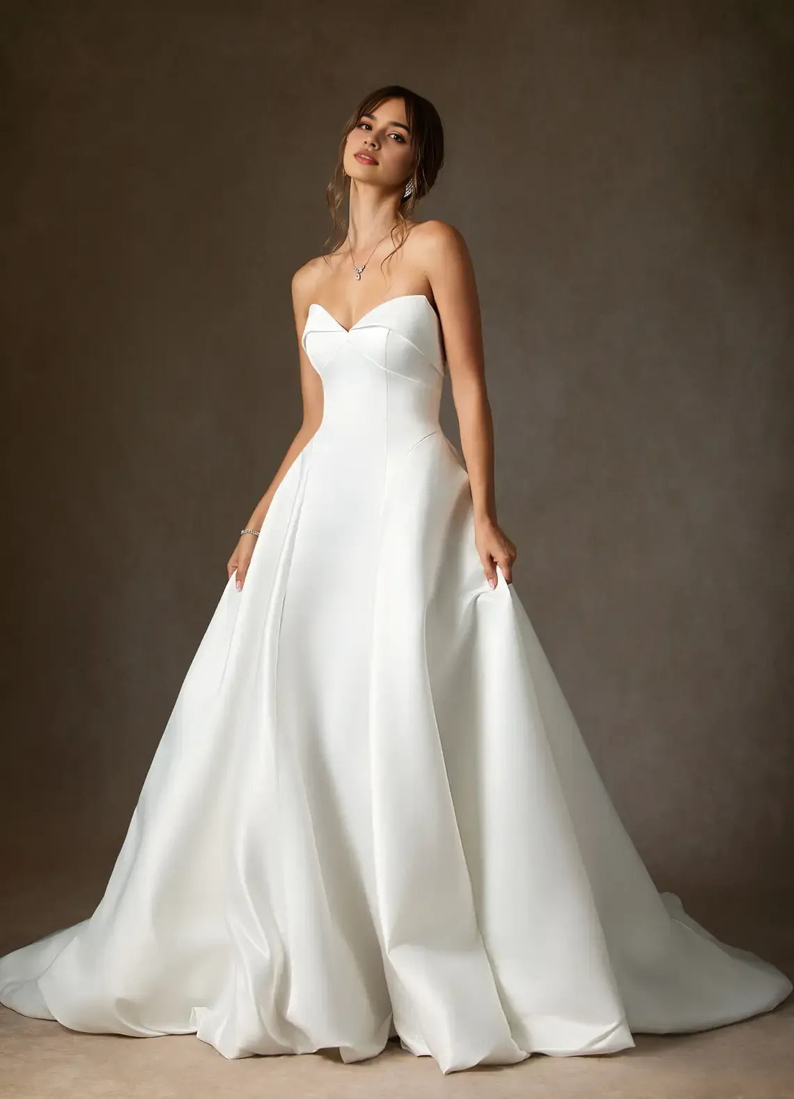 A-Line Wedding Dress Strapless Sweetheart Neck Structured Silhouette Subtle Volume Floor Length Train Ideal for Formal Bridal Looks