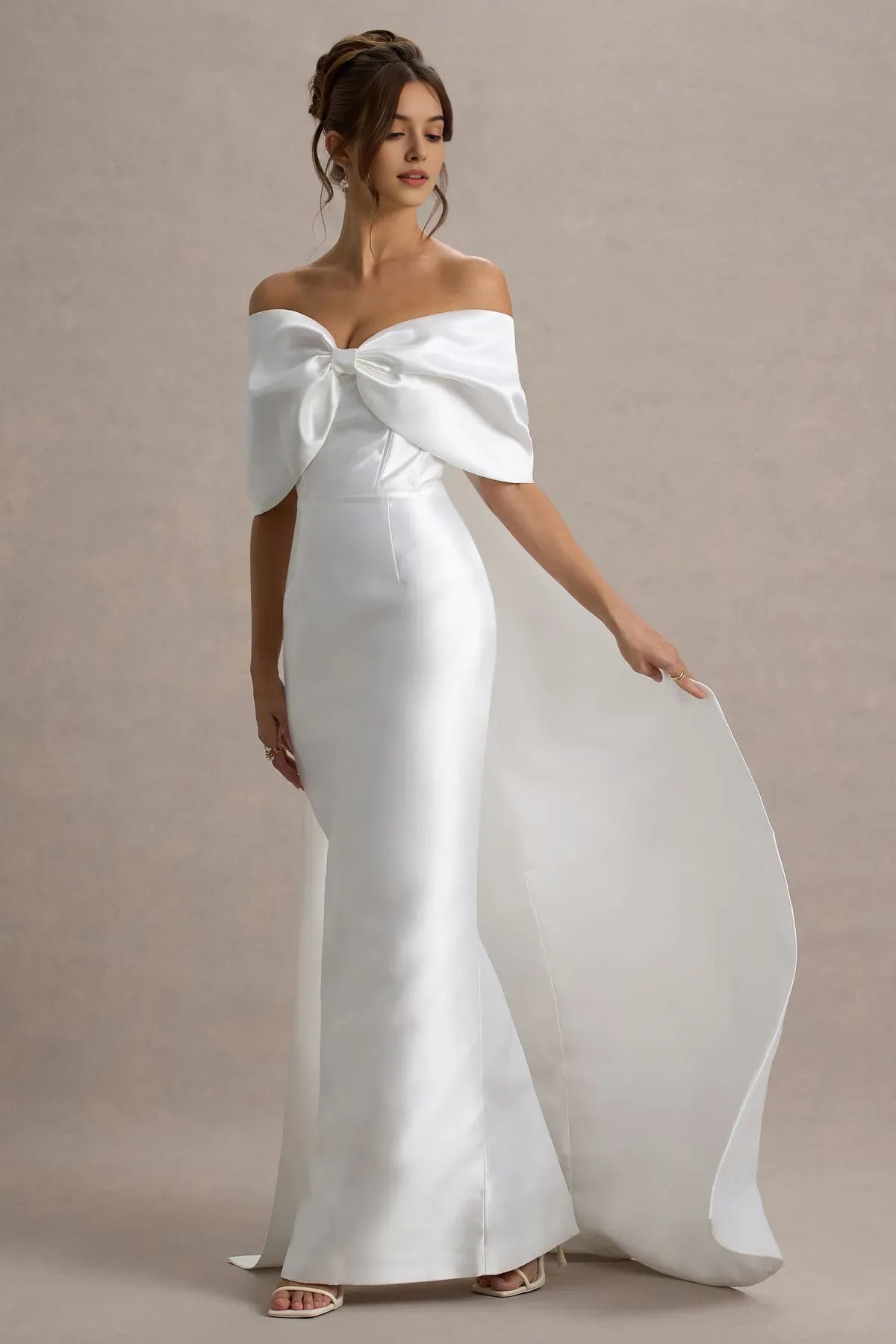 White Off - Shoulder Prom Dress with Bow Accent and Dramatic Train for Formal Galas