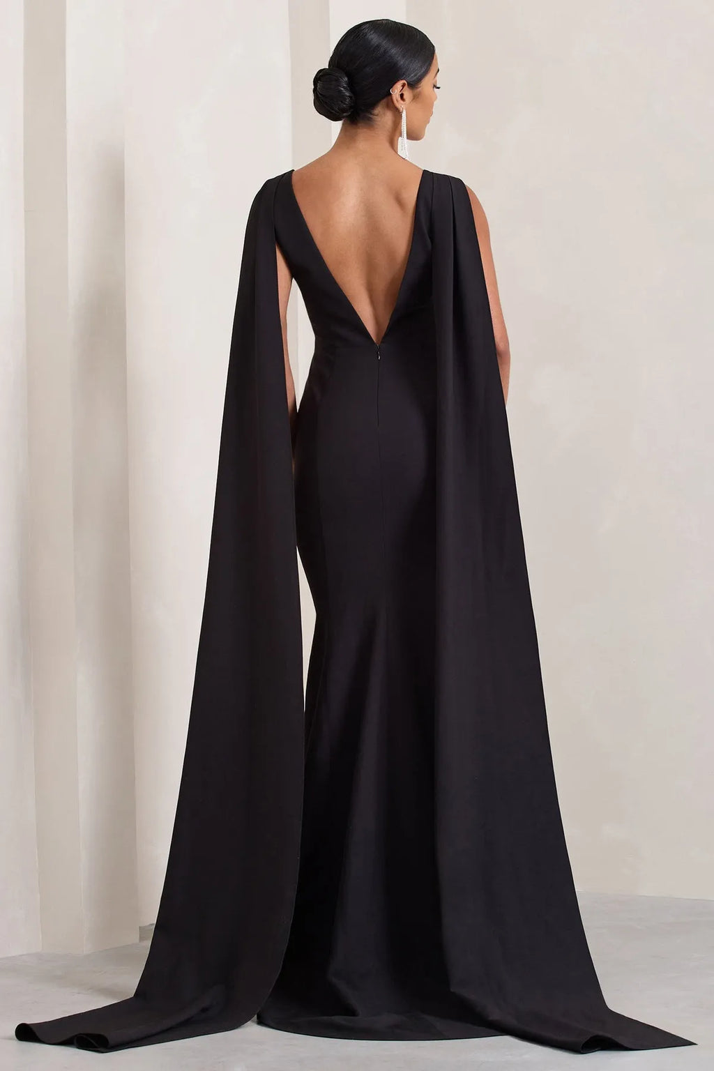Black Sleeveless Prom Dresses featuring Plunging V - Neck and Striking Cape - Inspired Side Panels Crafted to Dazzle