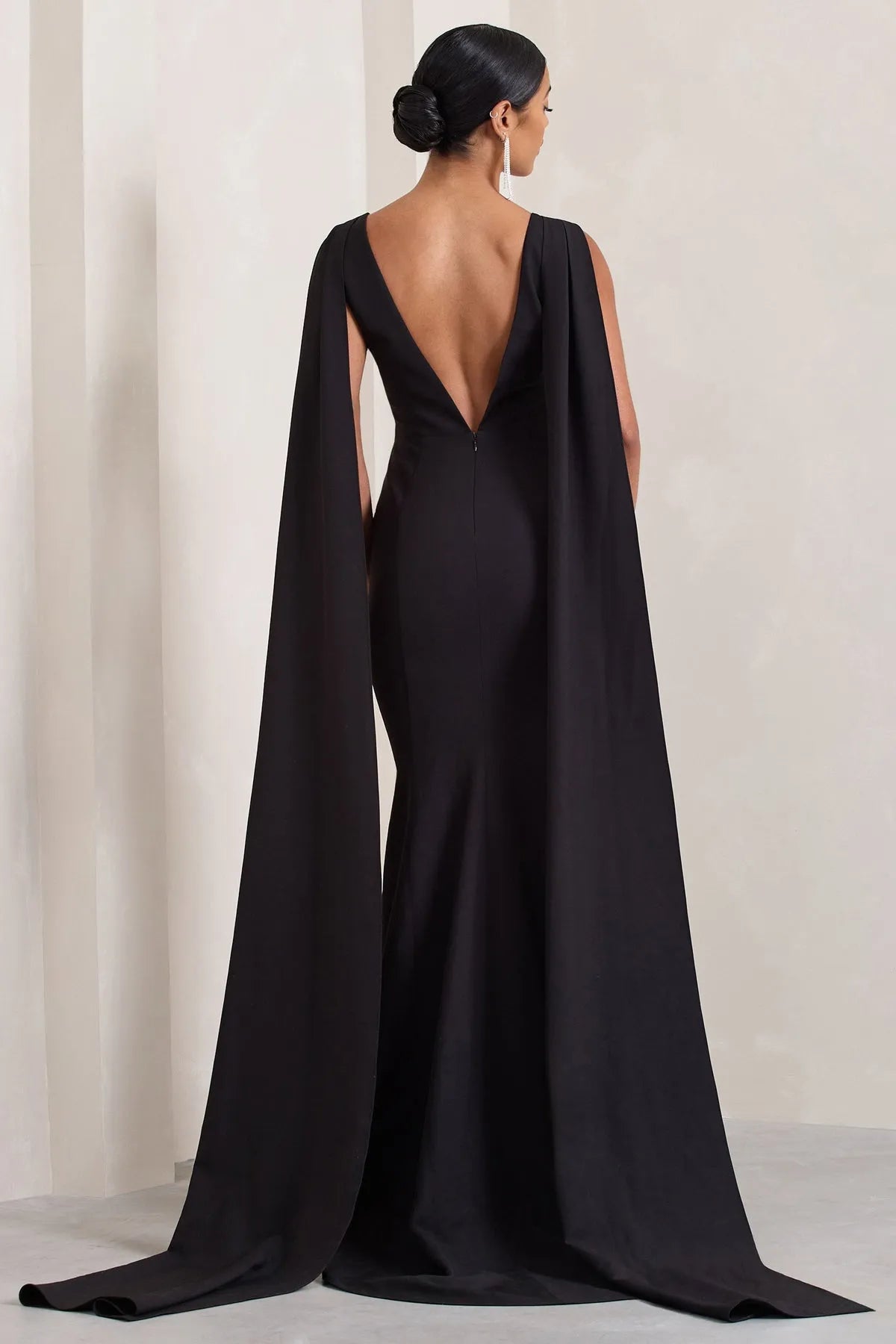 Black Sleeveless Prom Dresses featuring Plunging V - Neck and Striking Cape - Inspired Side Panels Crafted to Dazzle
