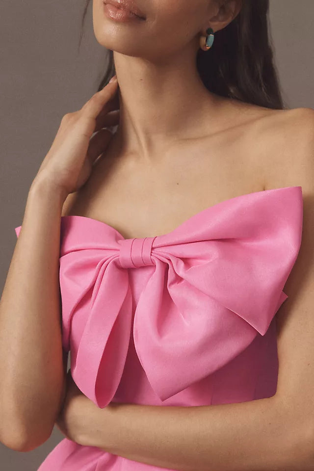 Pink Strapless Homecoming Gown Featuring Bold Bow Embellishment and Flattering Fit Crafted for Fashion Forward Teens