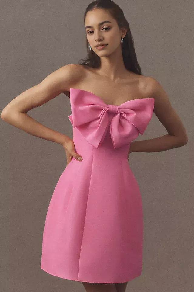 Pink Strapless Homecoming Gown Featuring Bold Bow Embellishment and Flattering Fit Crafted for Fashion Forward Teens