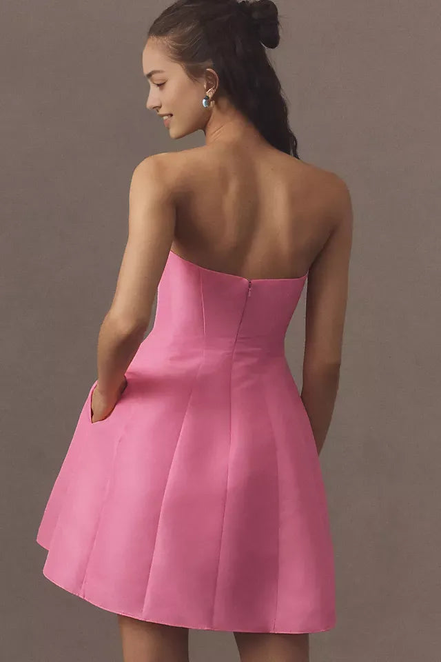 Pink Strapless Homecoming Gown Featuring Bold Bow Embellishment and Flattering Fit Crafted for Fashion Forward Teens