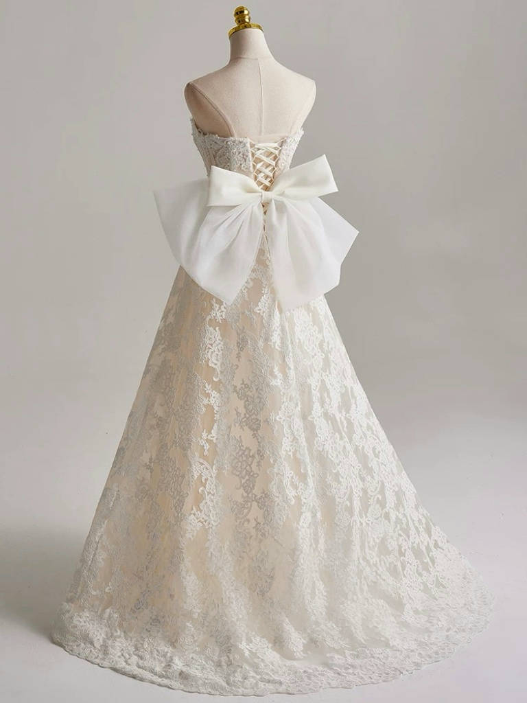 Romantic Strapless Wedding Dress with Bow Back Detail Floral Embroidery Corset Bodice and Ball Gown Silhouette for Fairytale Brides