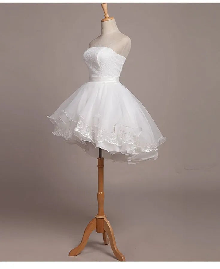 White Romantic Mini Dress with Strapless Neckline Skirt Asymmetric Ruffles and Detailing Ideal for Homecoming Style Statements