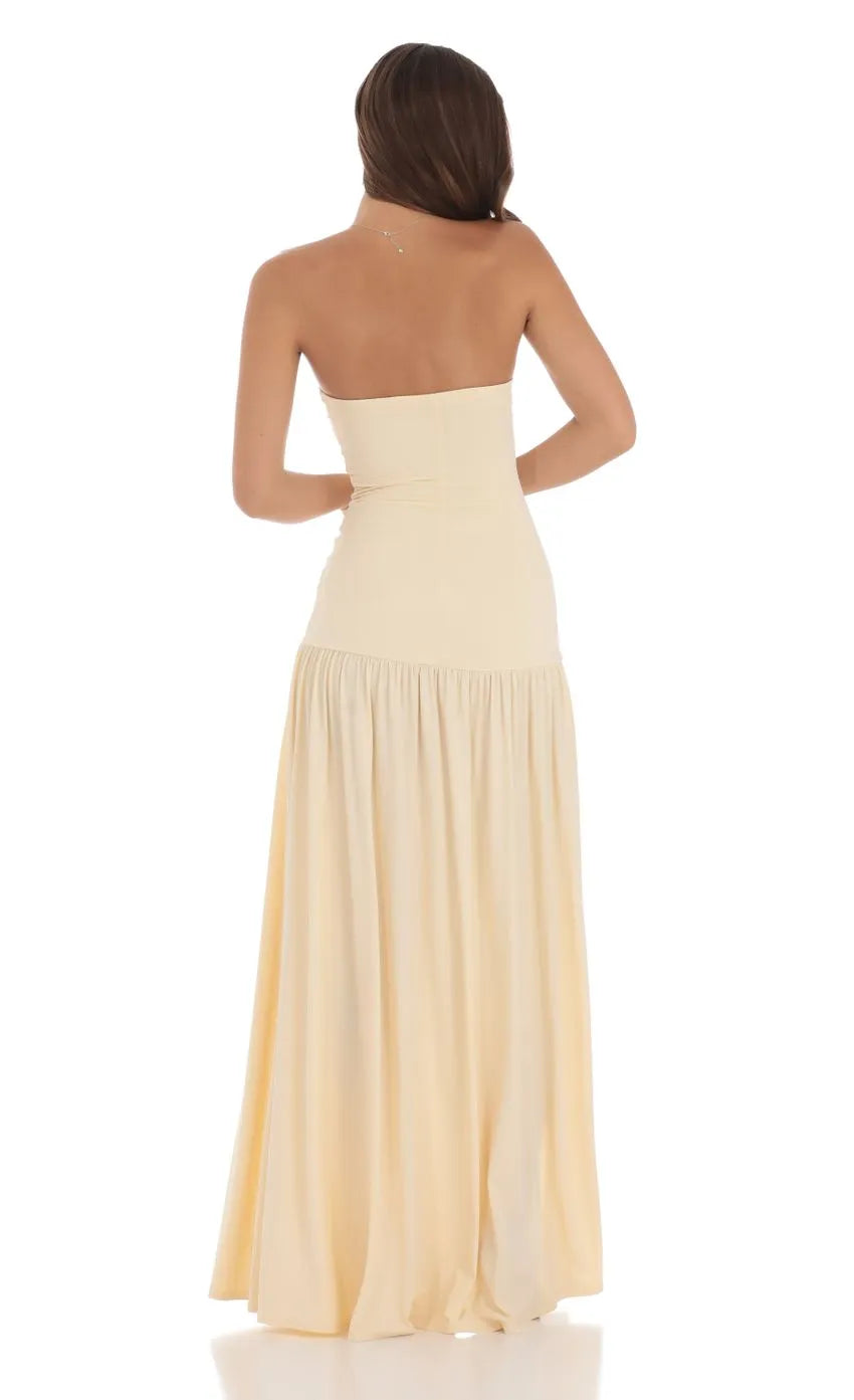 Strapless Beige Prom Dress with Ruched Bodice Pleated Skirt and Flattering Fit Designed for Elegant Prom Celebrations