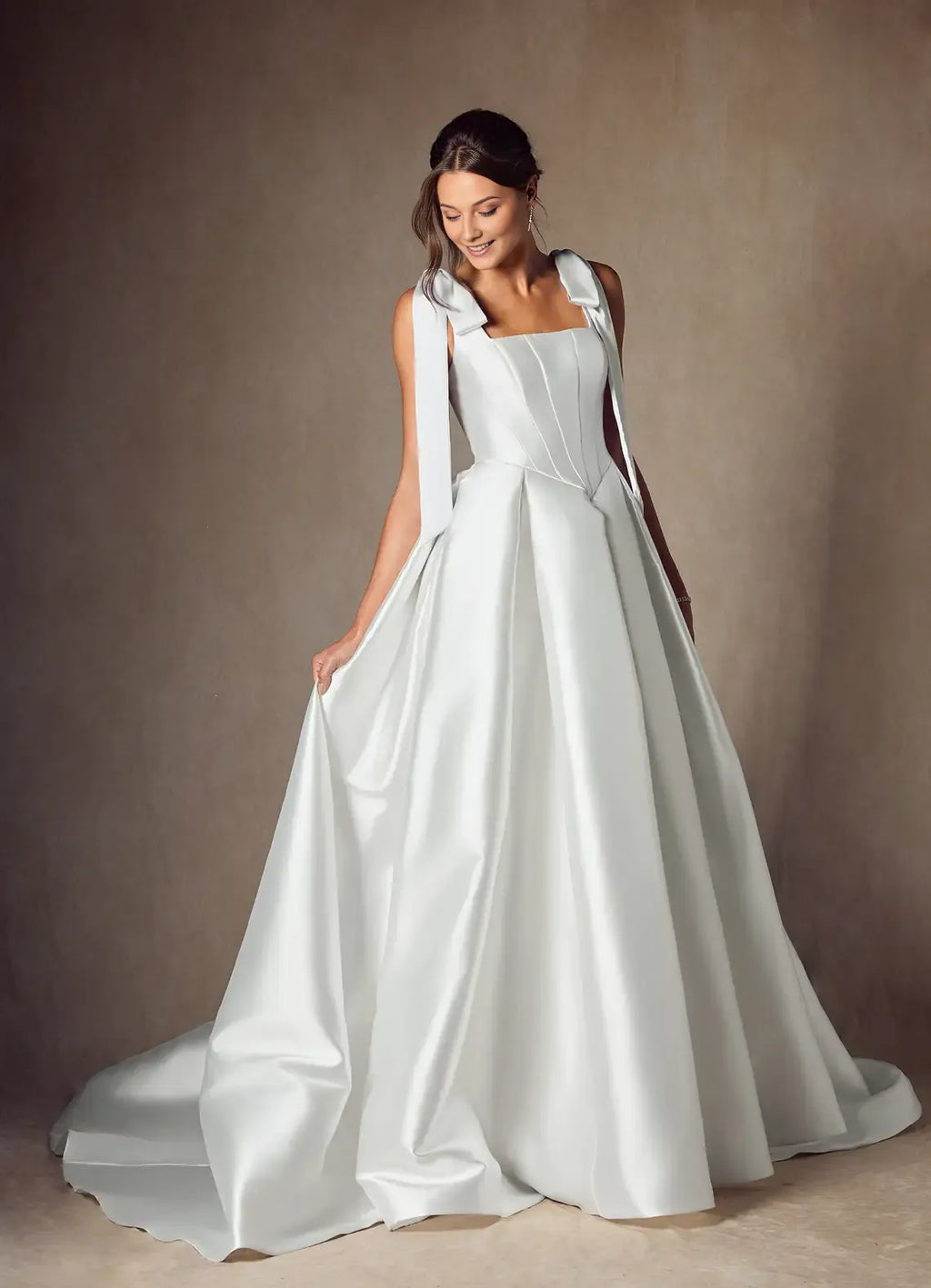legant Ball Gown Wedding Dress with Square Neckline Bow - Accented Straps and Structured Corset Bodice for Timeless Bridal Glamour