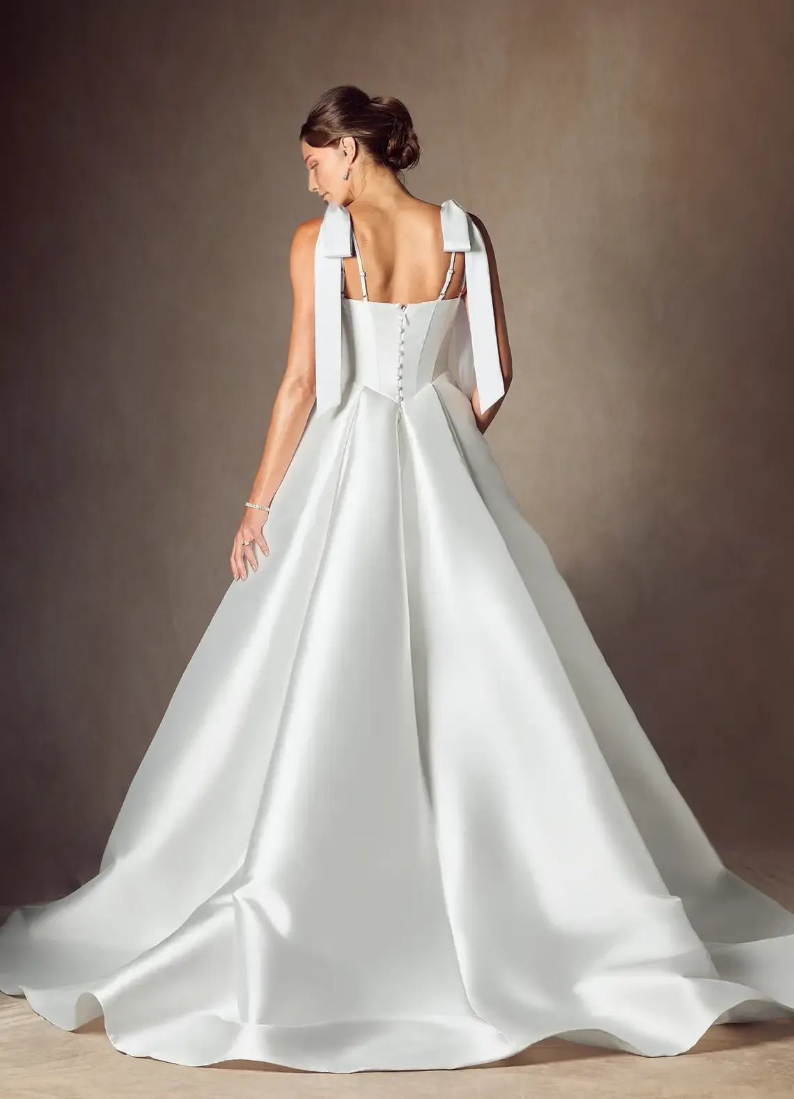 legant Ball Gown Wedding Dress with Square Neckline Bow - Accented Straps and Structured Corset Bodice for Timeless Bridal Glamour