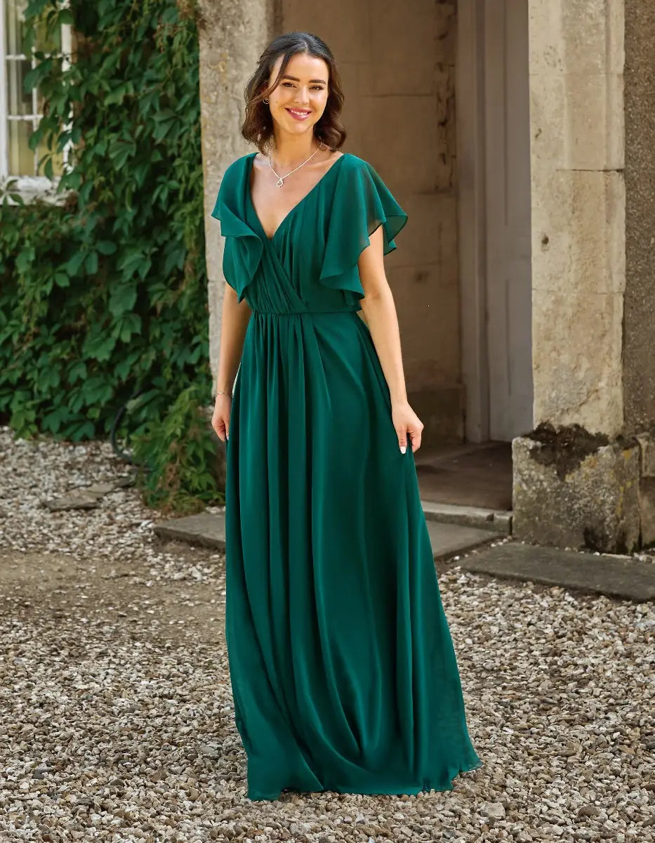 a modern draped bodice with lightweight angel sleeves