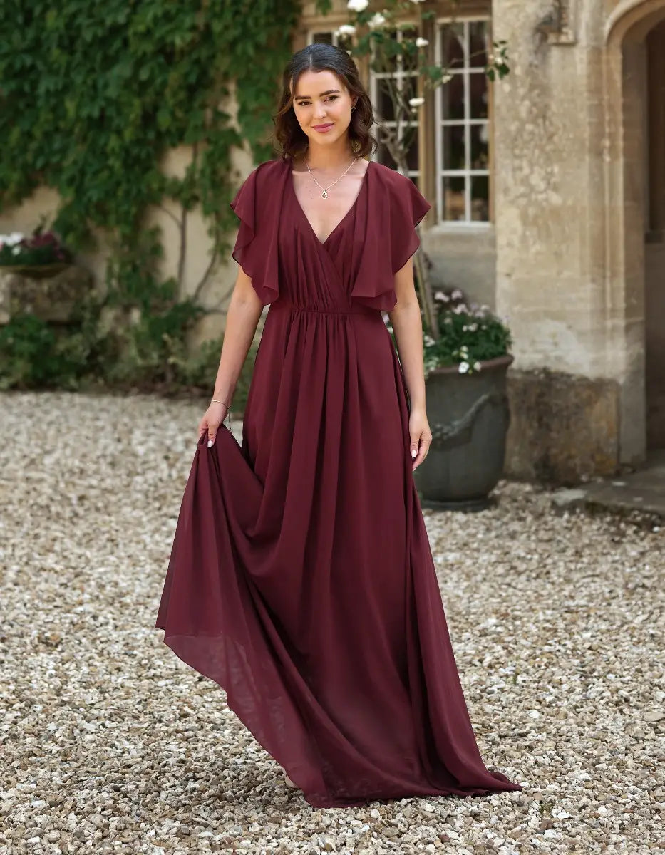 a modern draped bodice with lightweight angel sleeves