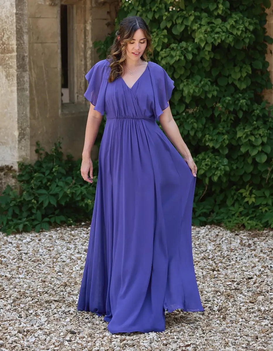 a modern draped bodice with lightweight angel sleeves