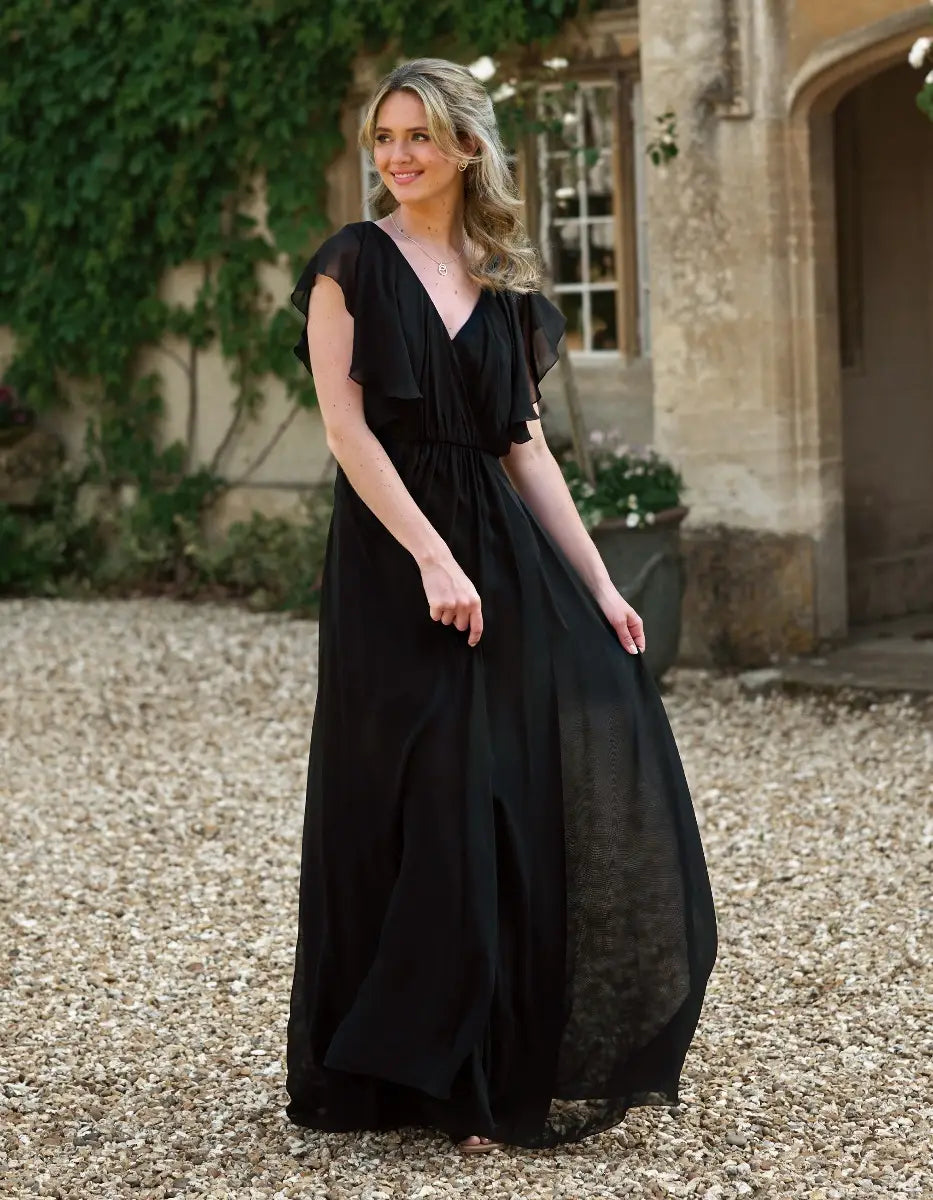 a modern draped bodice with lightweight angel sleeves