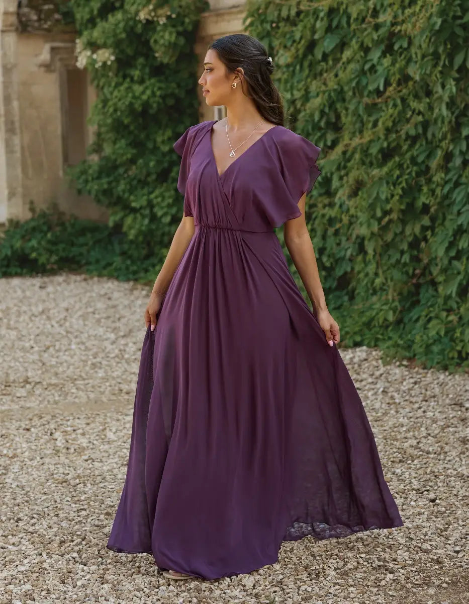 a modern draped bodice with lightweight angel sleeves