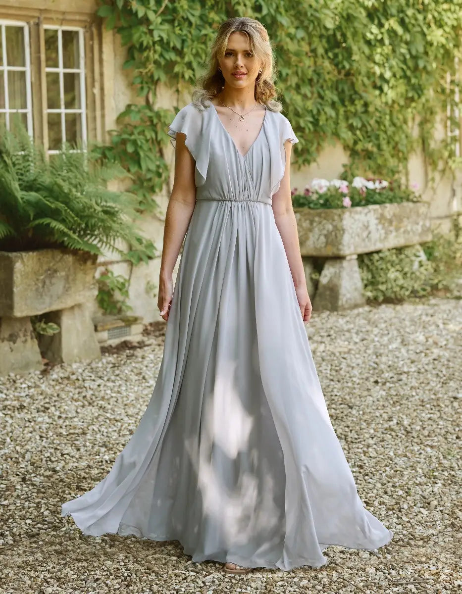 a modern draped bodice with lightweight angel sleeves
