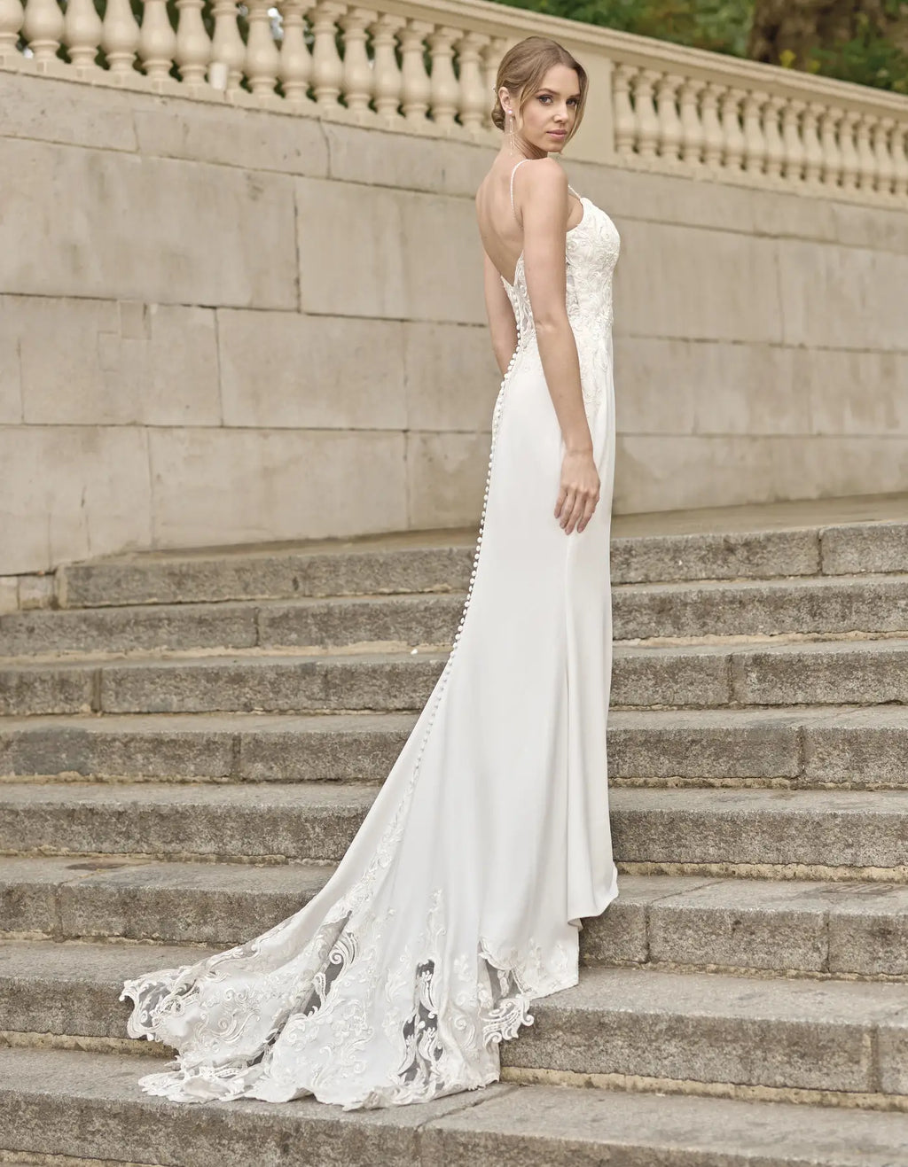 a sleek sheath gown with cut-out train
