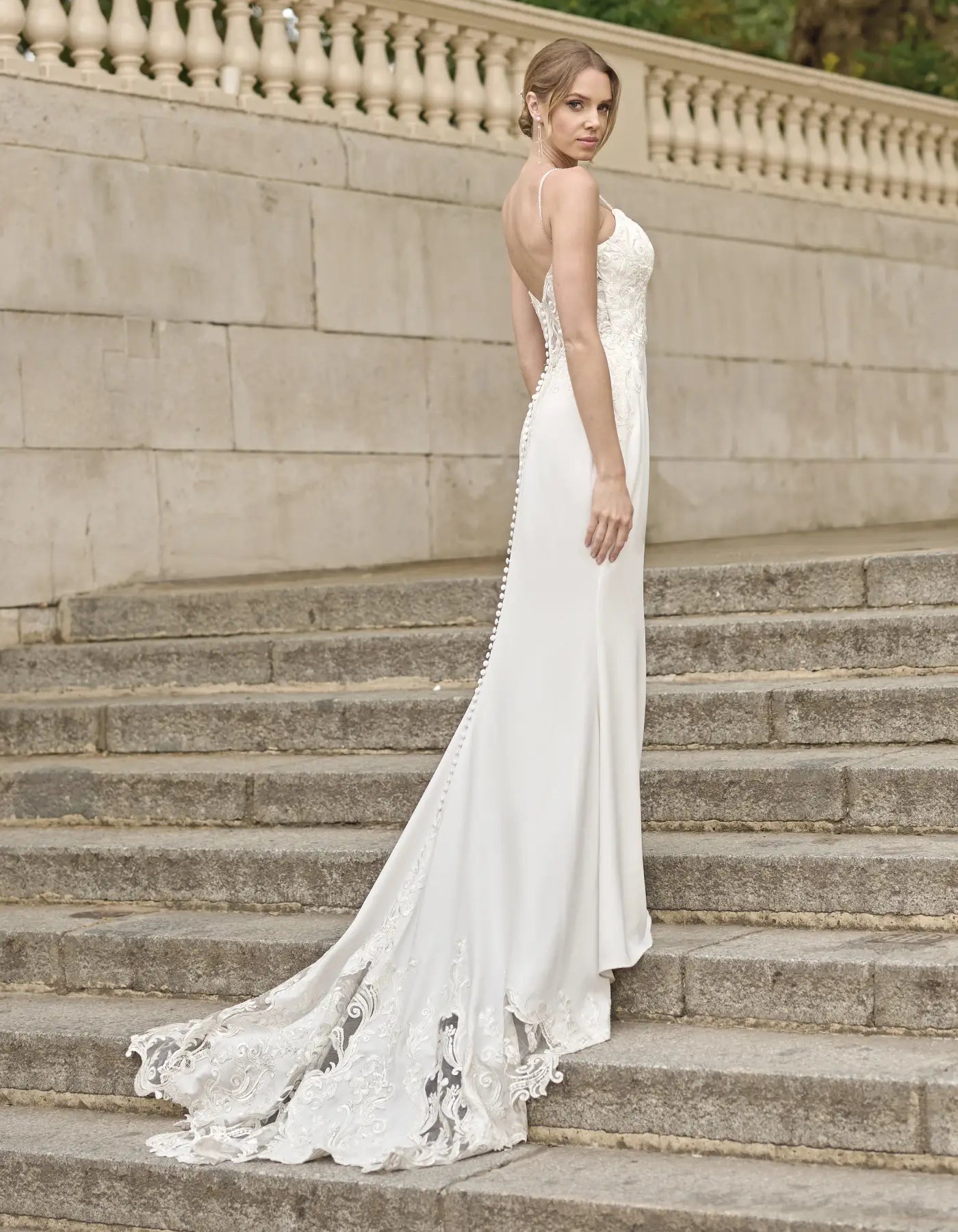 a sleek sheath gown with cut-out train